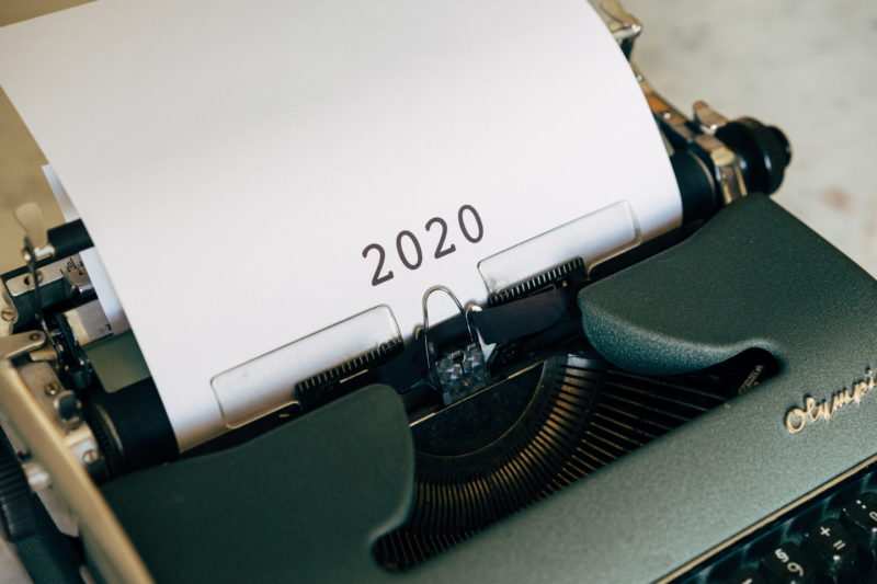 typewrite with white paper showing 2020