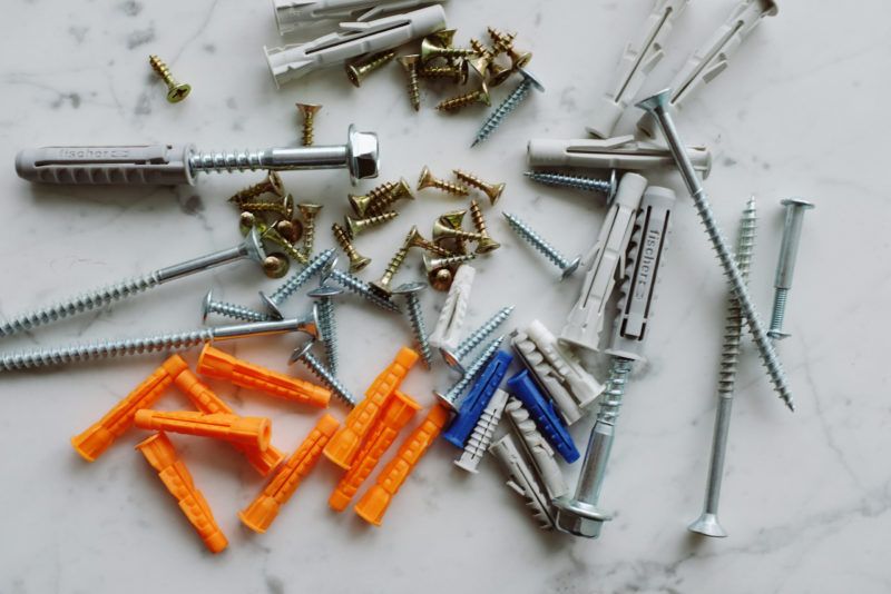 a bunch of multi-colored fasteners