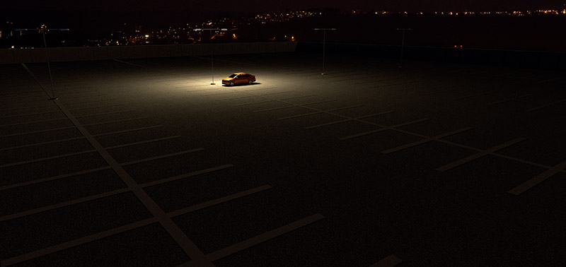 3D rendering of a sinngle car in a parking lot representing the concept of working late
