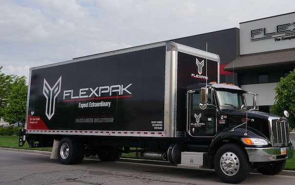flexpak-truck-infront-of-building
