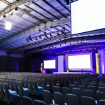 Rows of empty chairs in large Conference hall for Corporate Convention or Lecture