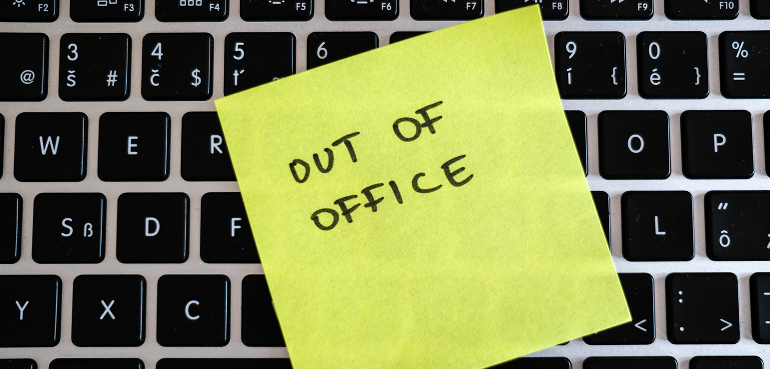 Vacation needed. Holiday office message on laptop. Out of office