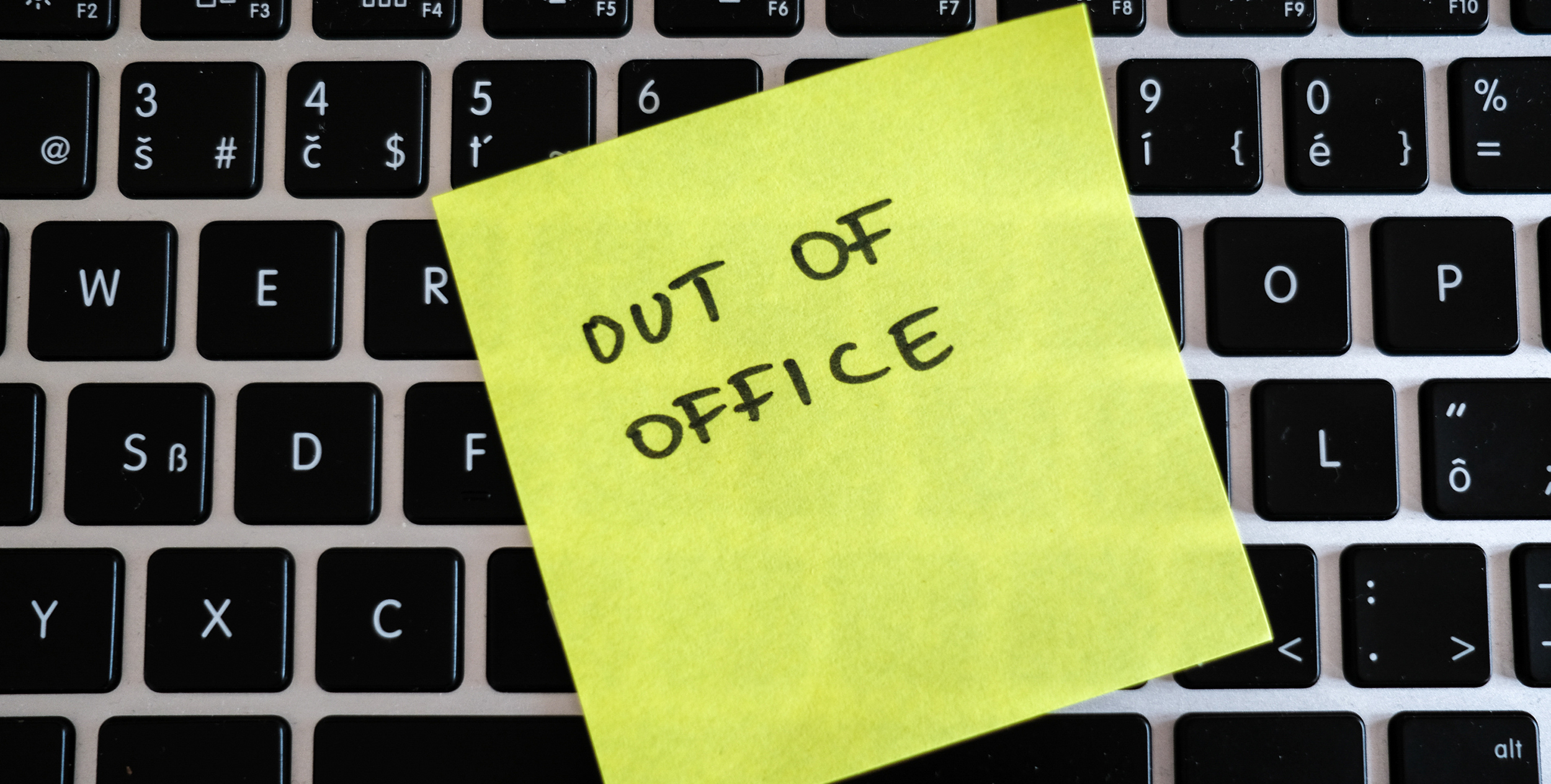 Vacation needed. Holiday office message on laptop. Out of office
