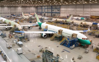 aviation company, showing the factory floor and assembly line, with workers building new aircraft, created with generative ai