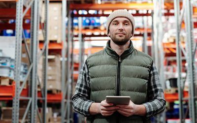 man in warehouse with tablet computer