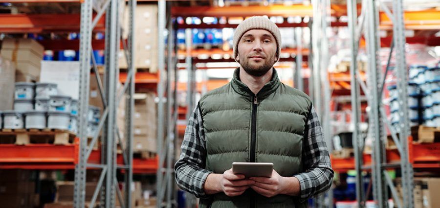 man in warehouse with tablet computer