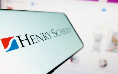Stuttgart, Germany - 07-02-2023: Cellphone with logo of American healthcare products company Henry Schein Inc. on screen in front of website. Focus on left of phone display.