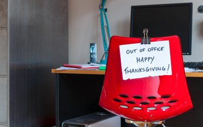 Employee leaves note on back of office chair: Out of Office. Happy Thanksgiving!