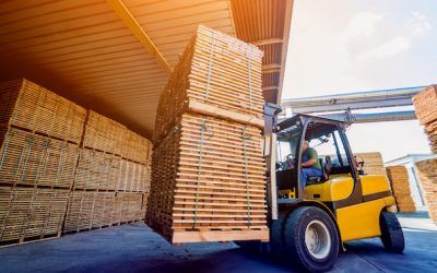 Forklift loader load lumber into a dry kiln. Wood drying in containers.