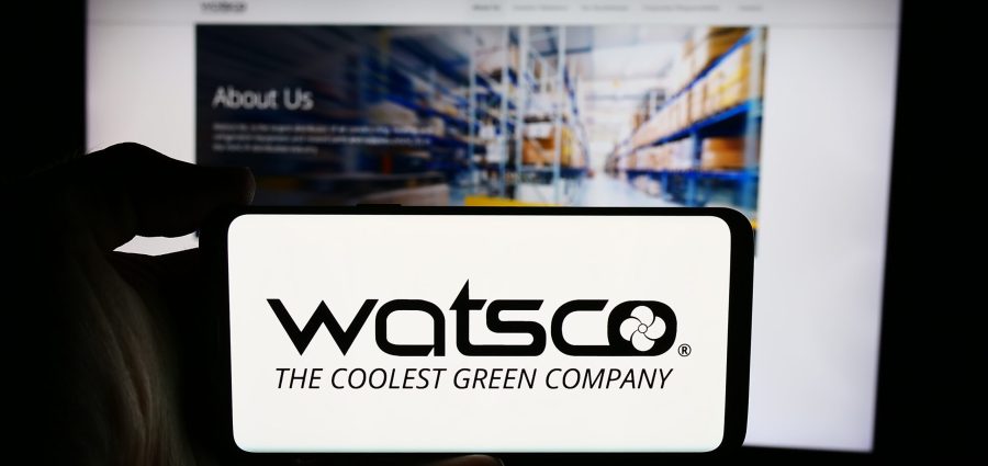 Stuttgart, Germany - 07-24-2024: Person holding cellphone with logo of US HVAC distribution company Watsco Inc. in front of business webpage. Focus on phone display.