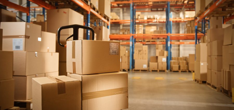 Big Retail Warehouse full of Shelves with Goods Stored on Manual