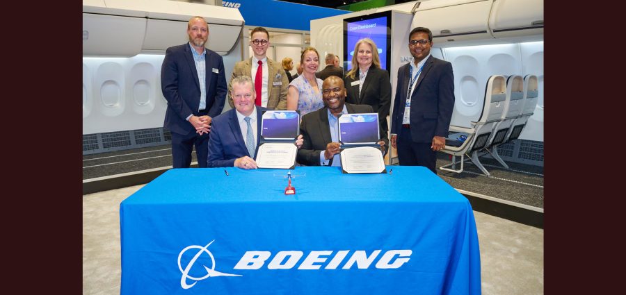 Brian Sartain (left), chief operating officer, Ontic, and William Ampofo, vice president, Parts & Distribution Services and Supply Chain, Boeing Global Services, are joined by their teams for to mark the signing of a new 10-year exclusive distribution agreement.
