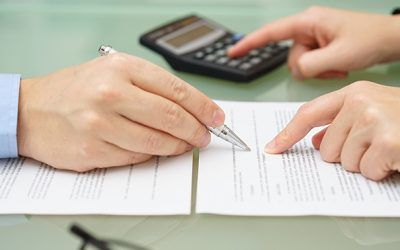 calculating cost to serve with two people reviewing a contract