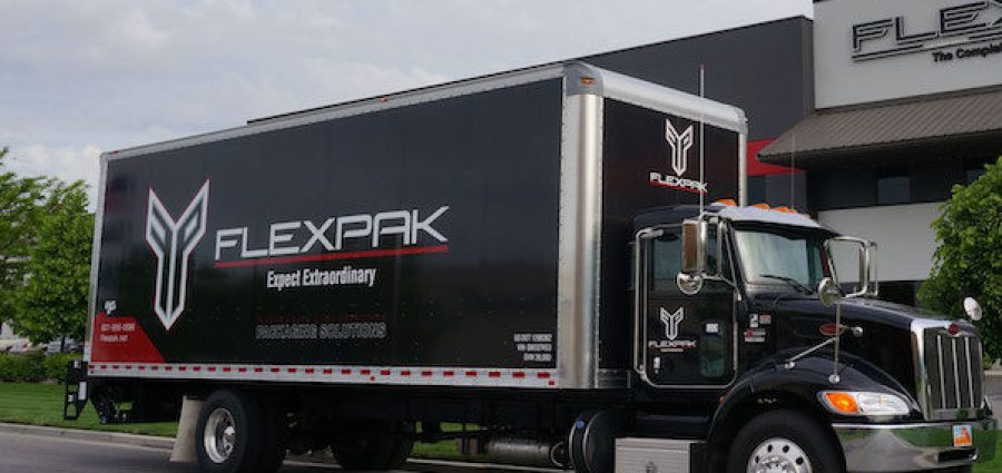 flexpak-truck-infront-of-building