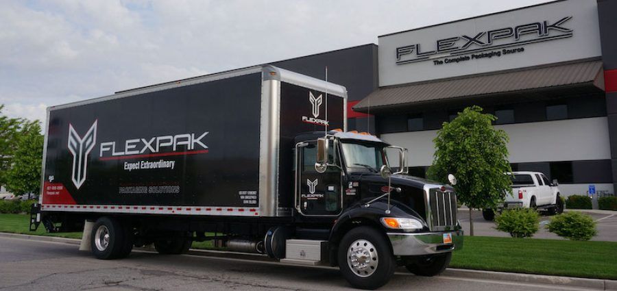 flexpak-truck-infront-of-building