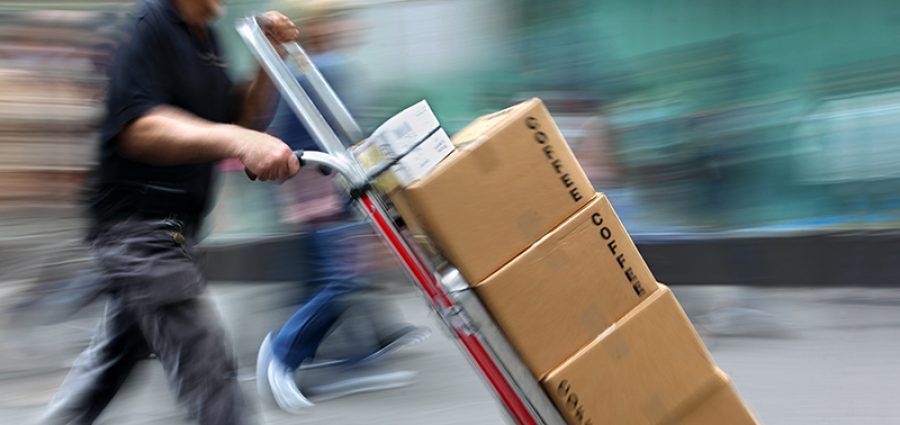 delivery goods with dolly by hand, purposely motion blur