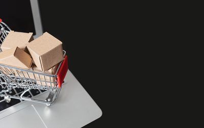e-commerce, shopping trolley with paper boxes. Trade, selling via internet